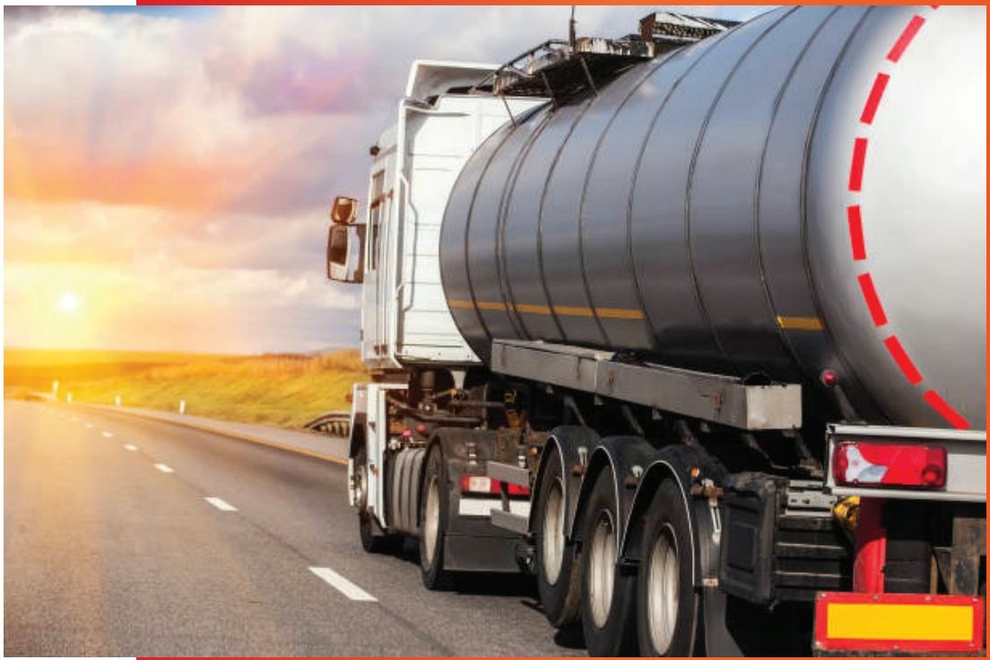 Fuel tanker truck on the road at sunset